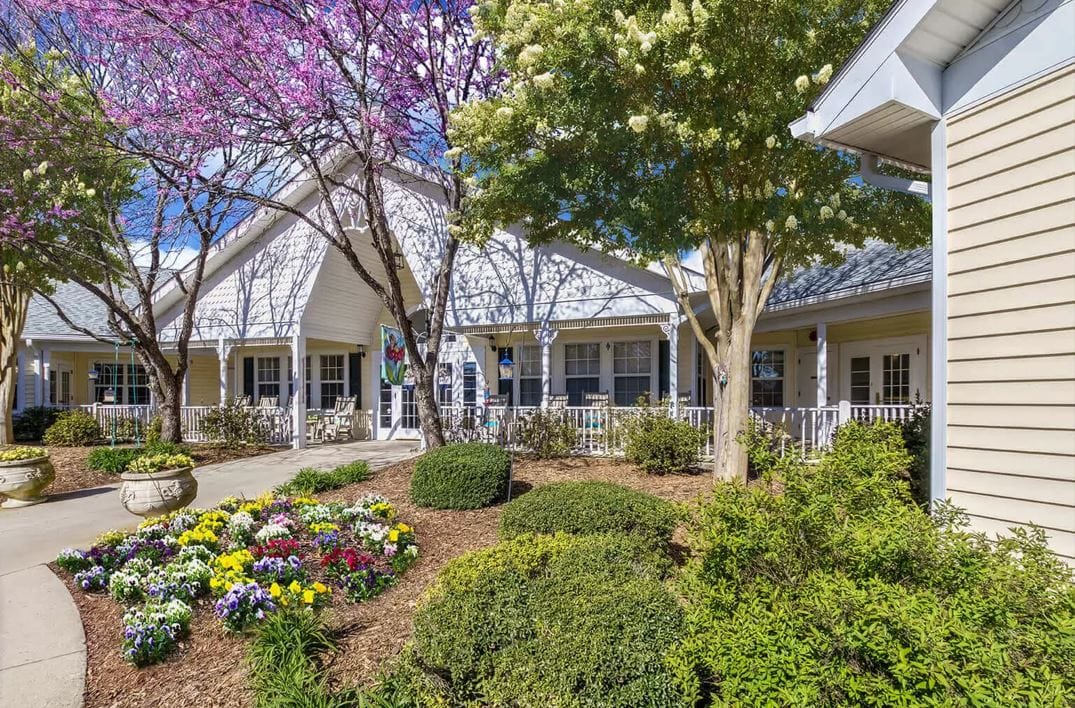 Exterior view of TerraBella Shelby with garden and trees