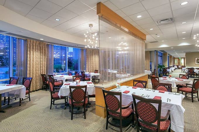 Elegant dining room with tables set for dining