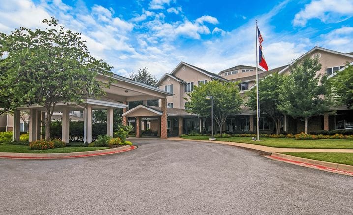 Exterior view of Whiterock Court with entrance and American flag