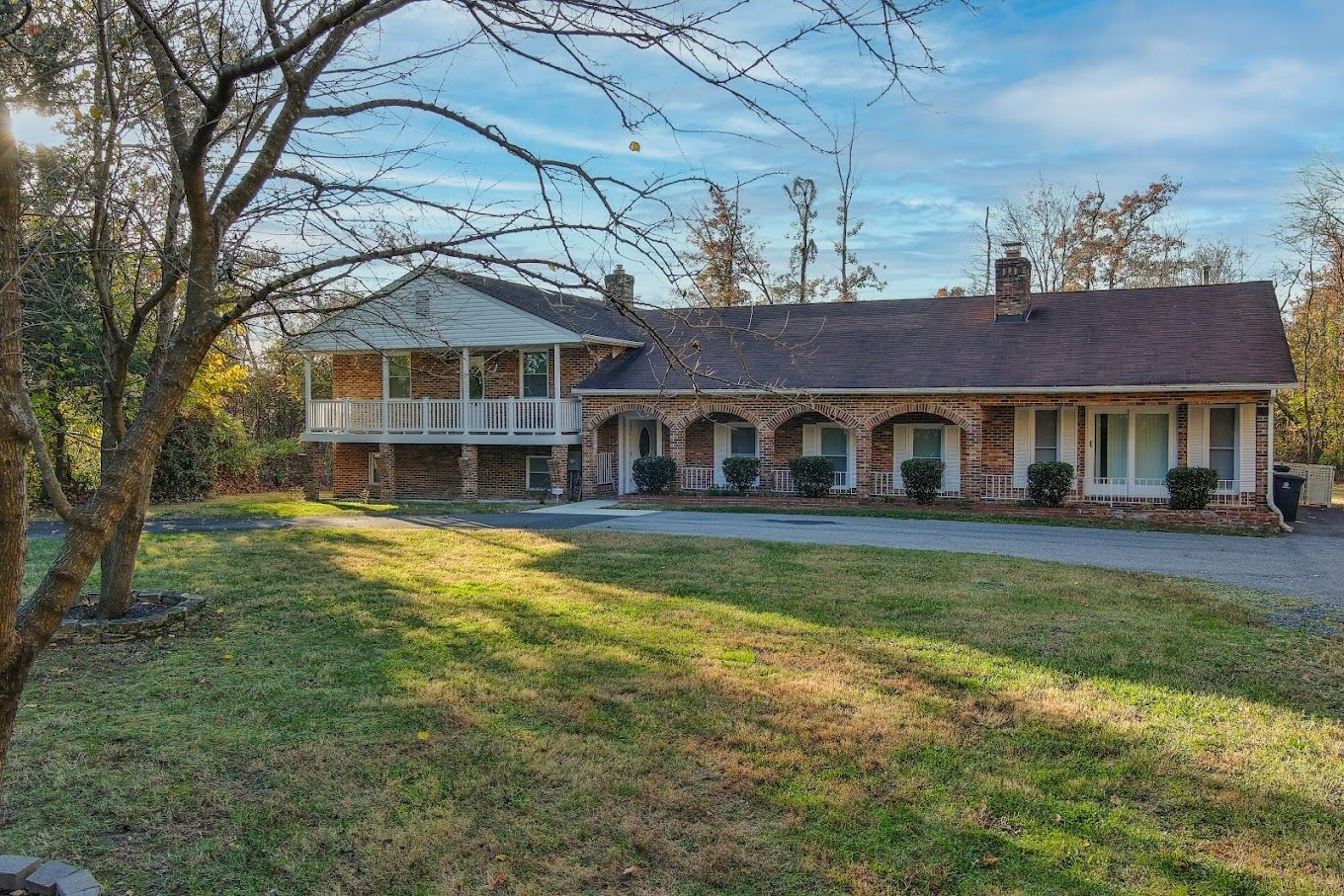Exterior view of a senior living facility with lawn
