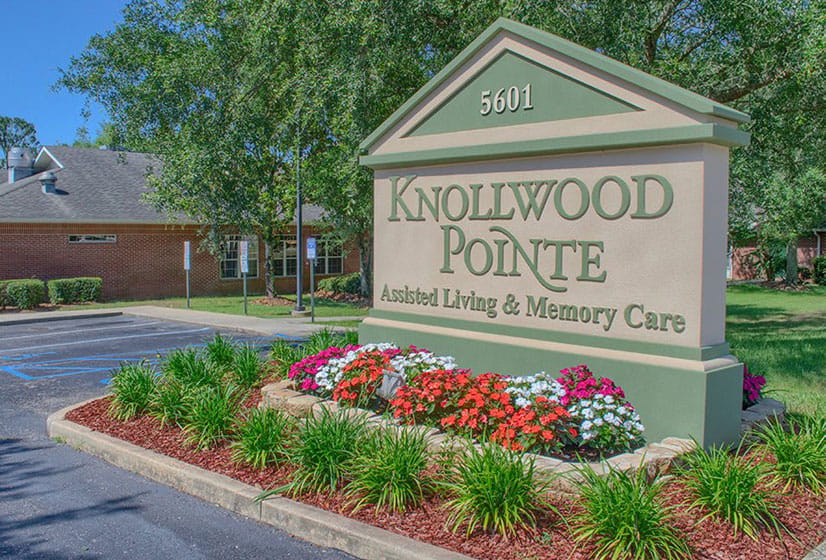 Exterior view of Knollwood Pointe sign and landscaping.
