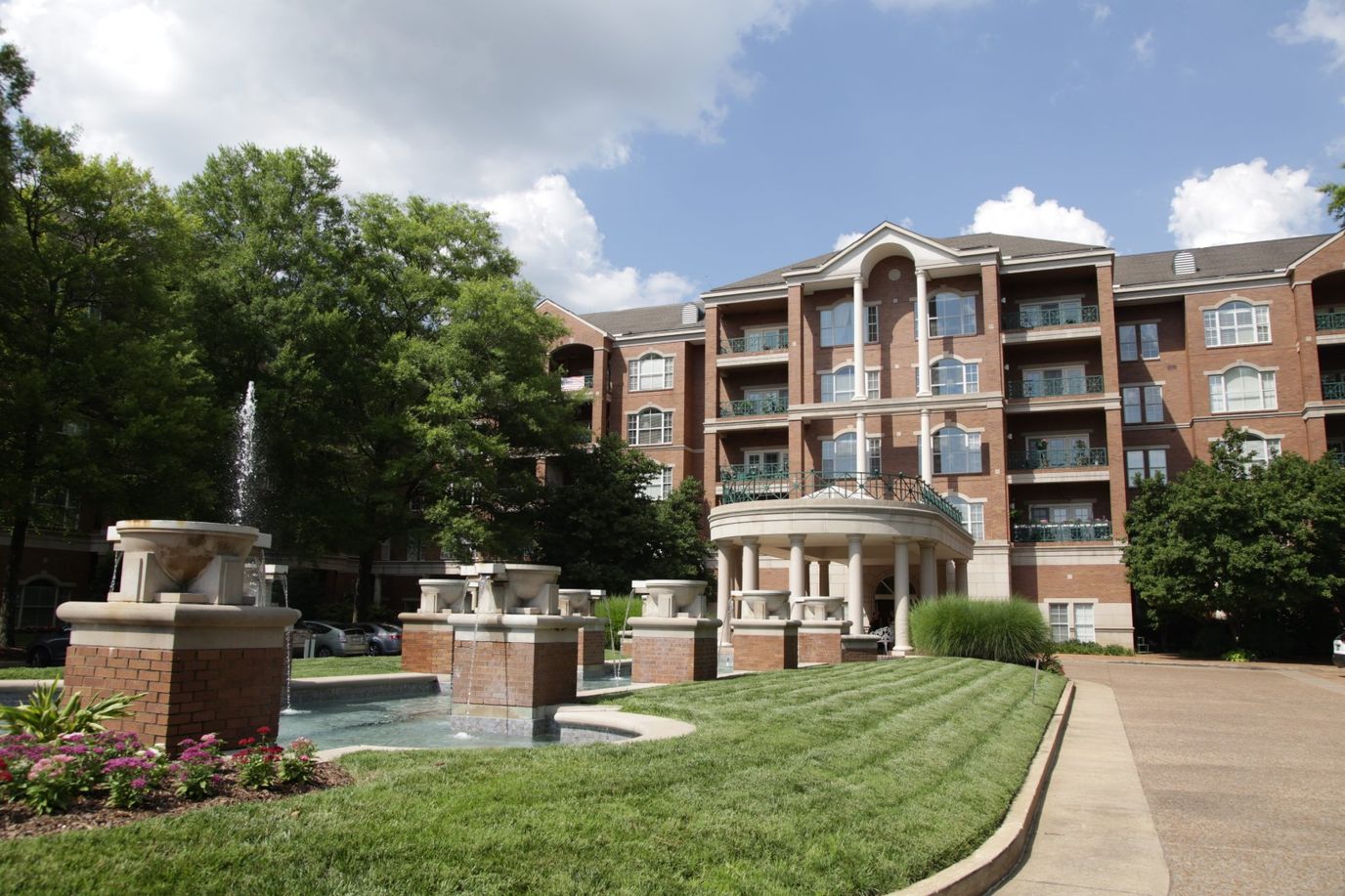 Exterior view of Richland Place with gardens and fountain