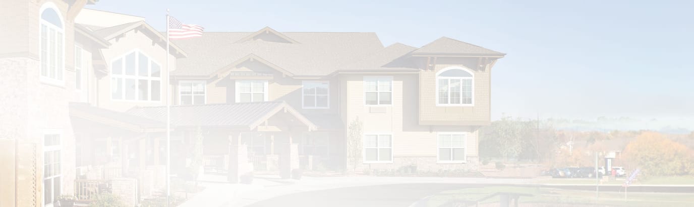 Exterior view of the assisted living facility with landscaping