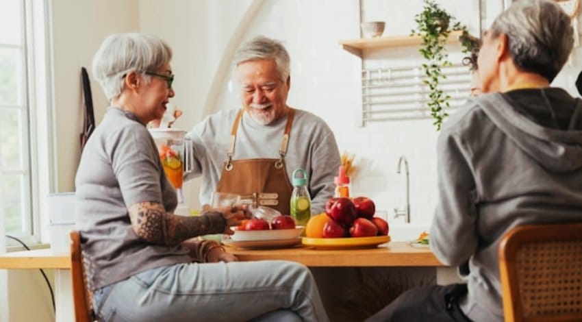 Residents enjoying meal preparation together