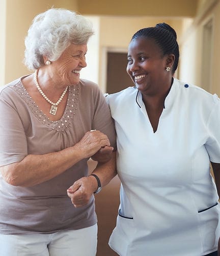 White Rose Home Care, home care in Bradford, UK — Senior caregiver and elderly resident enjoying a joyful moment