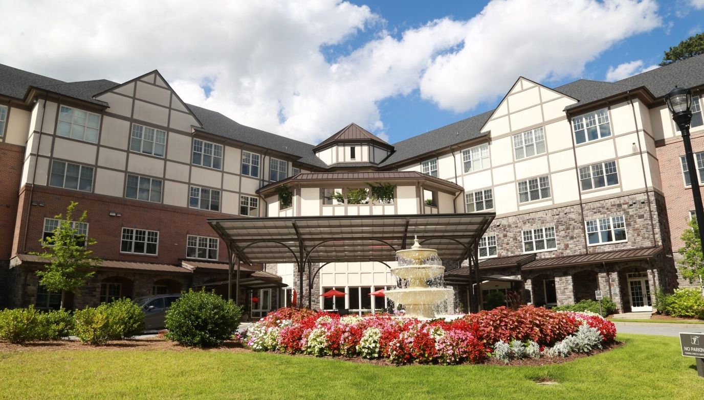 Exterior view of Peachtree Hills Place with landscaped fountain