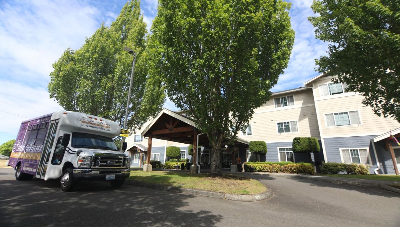 Facility exterior with transport shuttle and trees