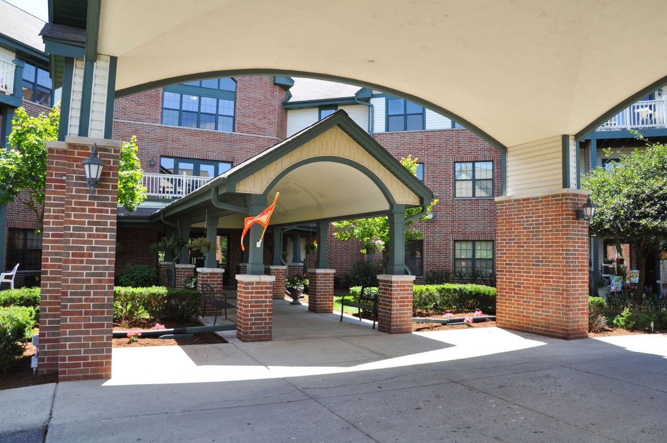 Entrance of Charter Senior Living with gardens