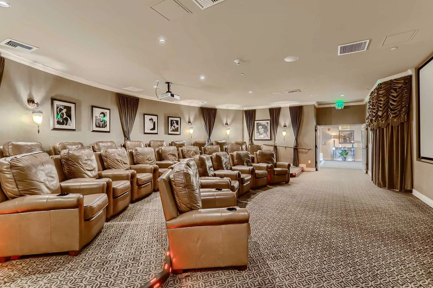 Capriana, assisted living in Brea, CA — Cozy theater seating in a residential community cinema