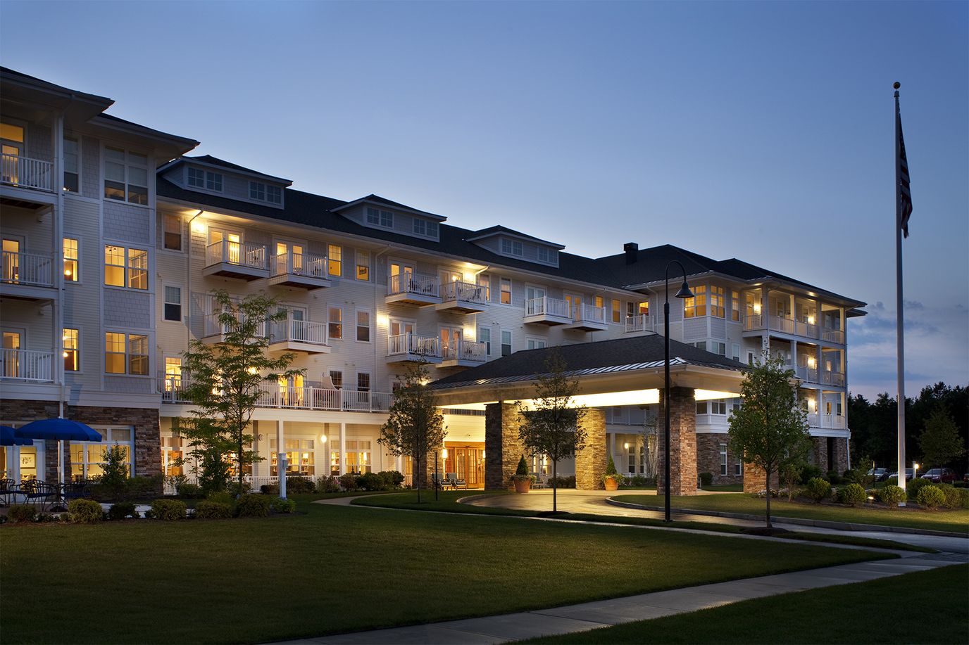 Exterior view of Welch Senior Living at dusk