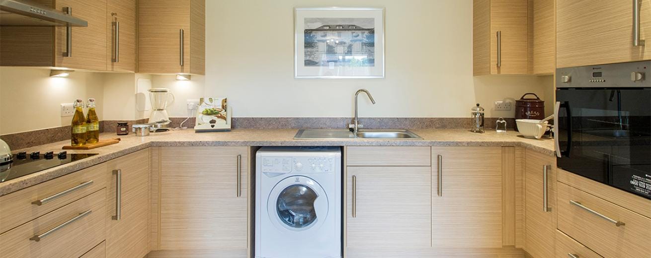 Well-equipped kitchen in a senior living unit