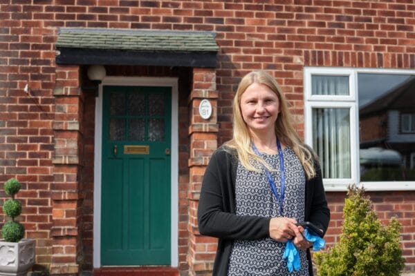 Bridgewater Home Care, home care in Warrington, UK — Person standing in front of a brick building entrance