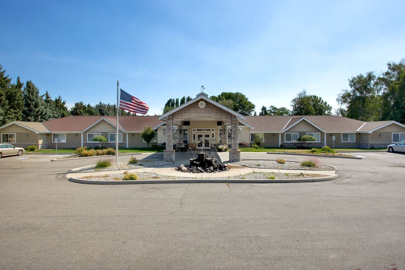 Front view of Blossom Creek facility with landscaped garden