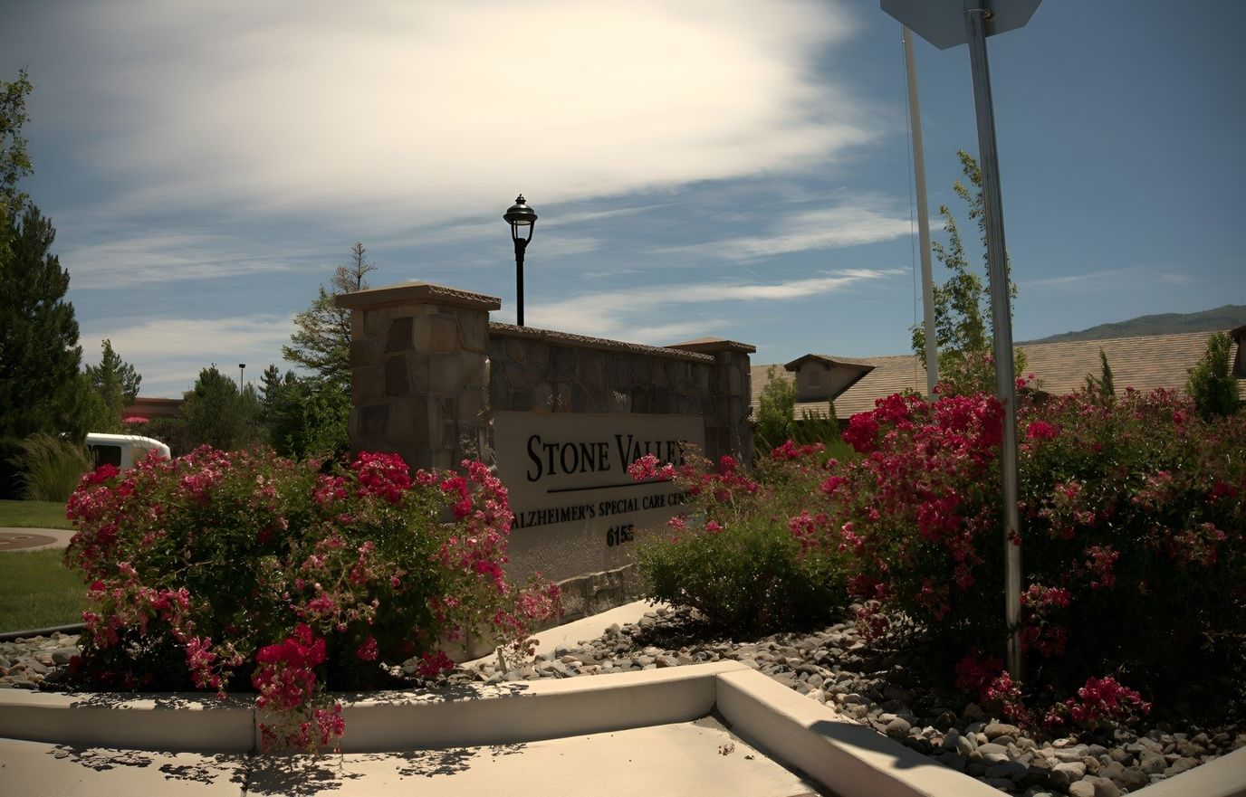 Stone Valley Memory Care facility sign with flowers