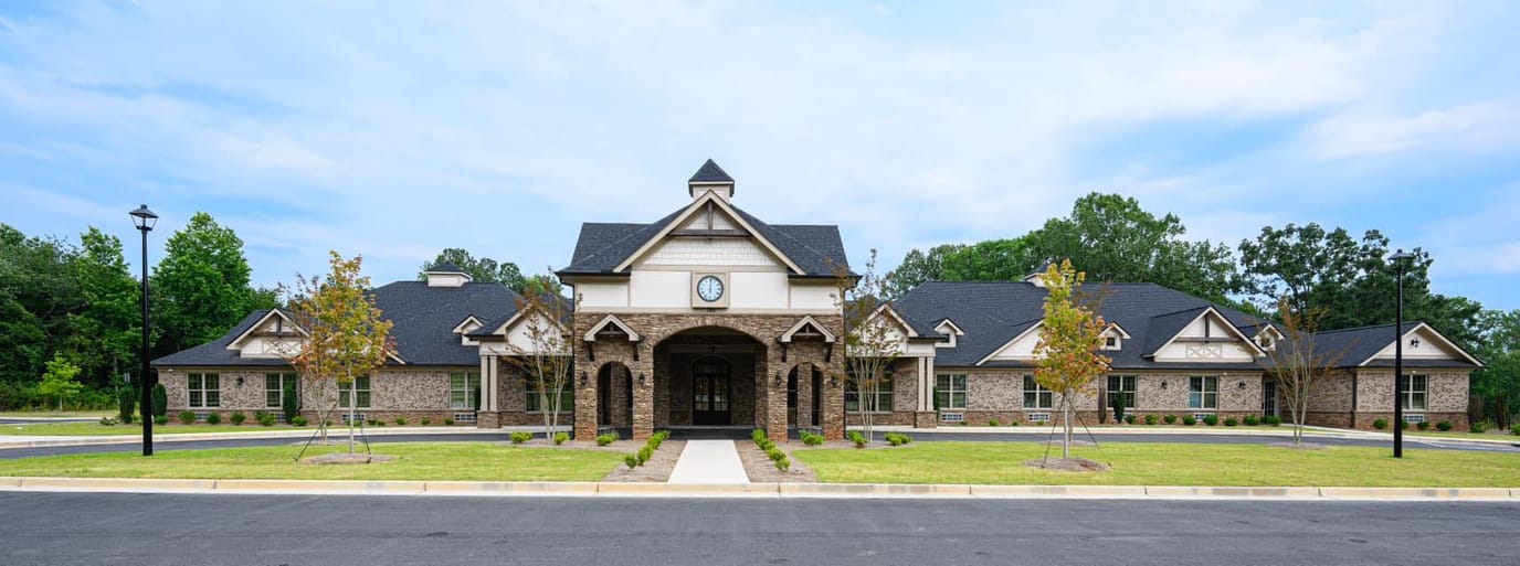 Front view of Magnolia Senior Living facility with landscaped entrance