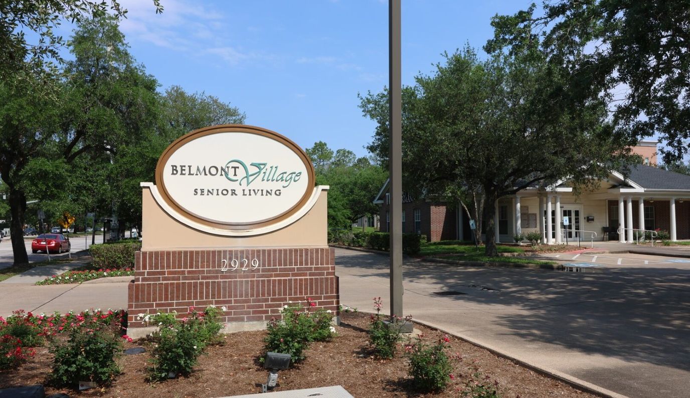Exterior view of Belmont Village Senior Living entrance sign