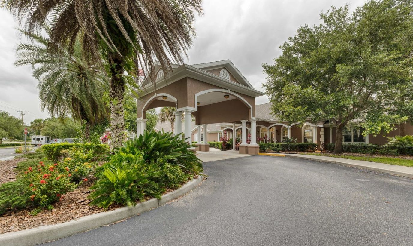 Entrance of Addington Place of Titusville with landscaped surroundings