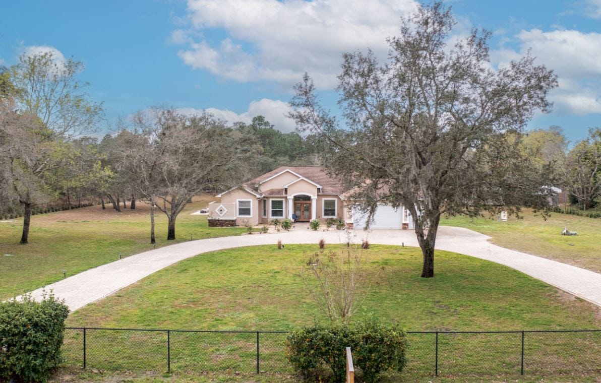 Exterior view of Aliviya Rose Manor surrounded by landscaping
