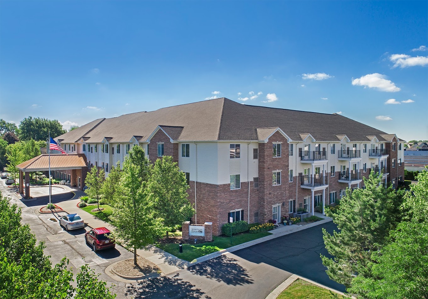 Aerial view of a senior living facility surrounded by trees