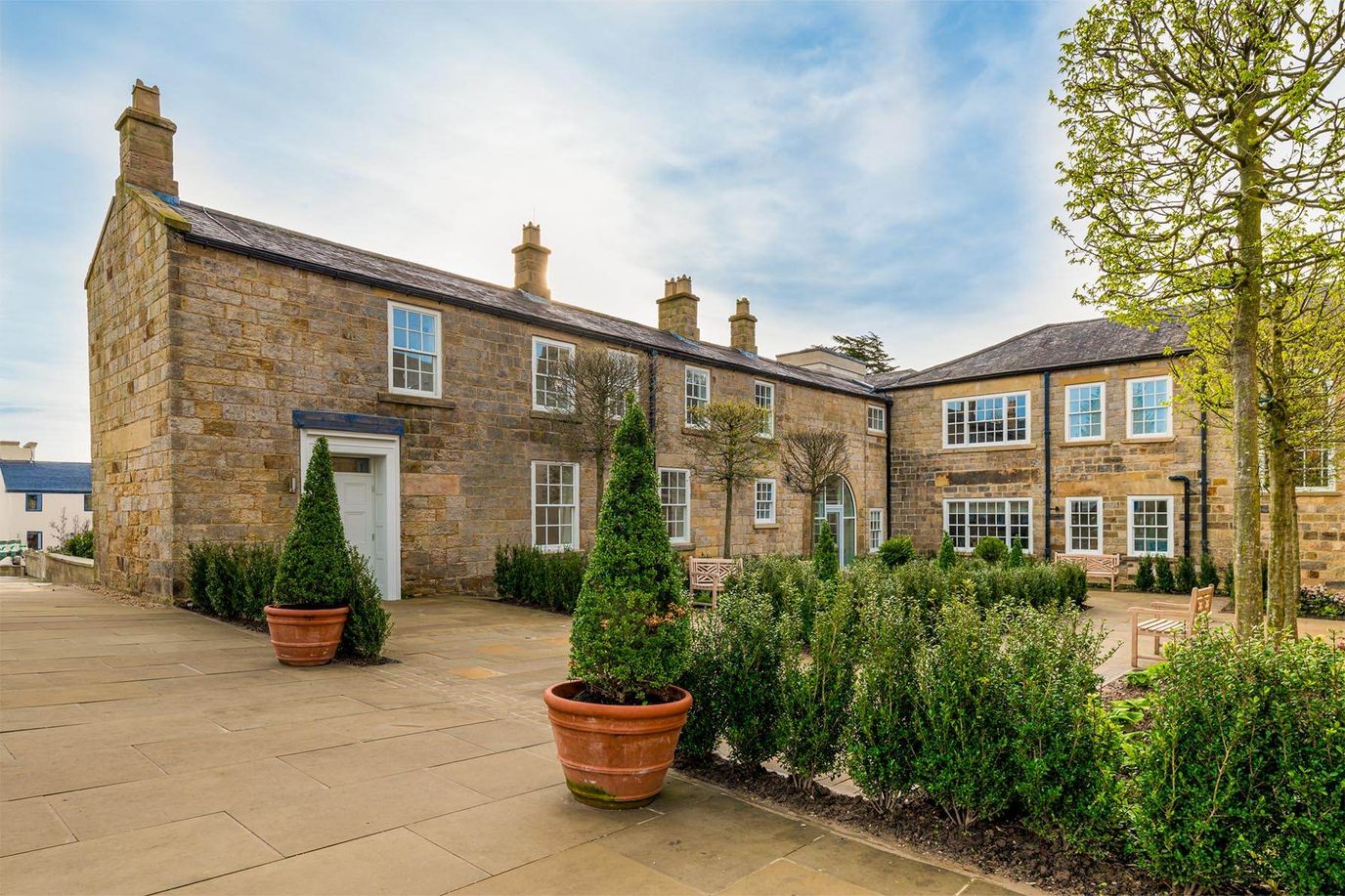 Exterior view of a well-maintained assisted living facility