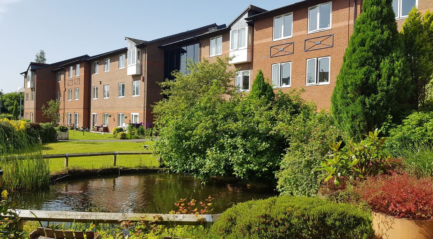 Exterior view of Berryhill Village surrounded by gardens