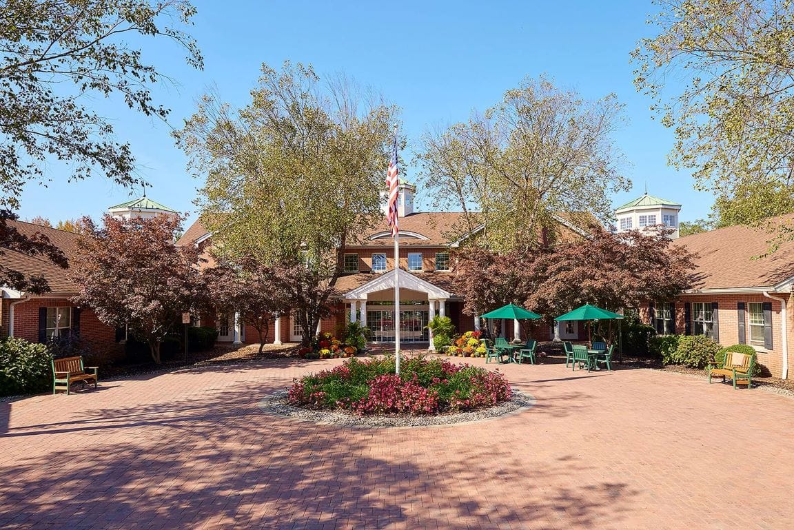 Exterior view of the Brandywine Colts Neck facility with gardens