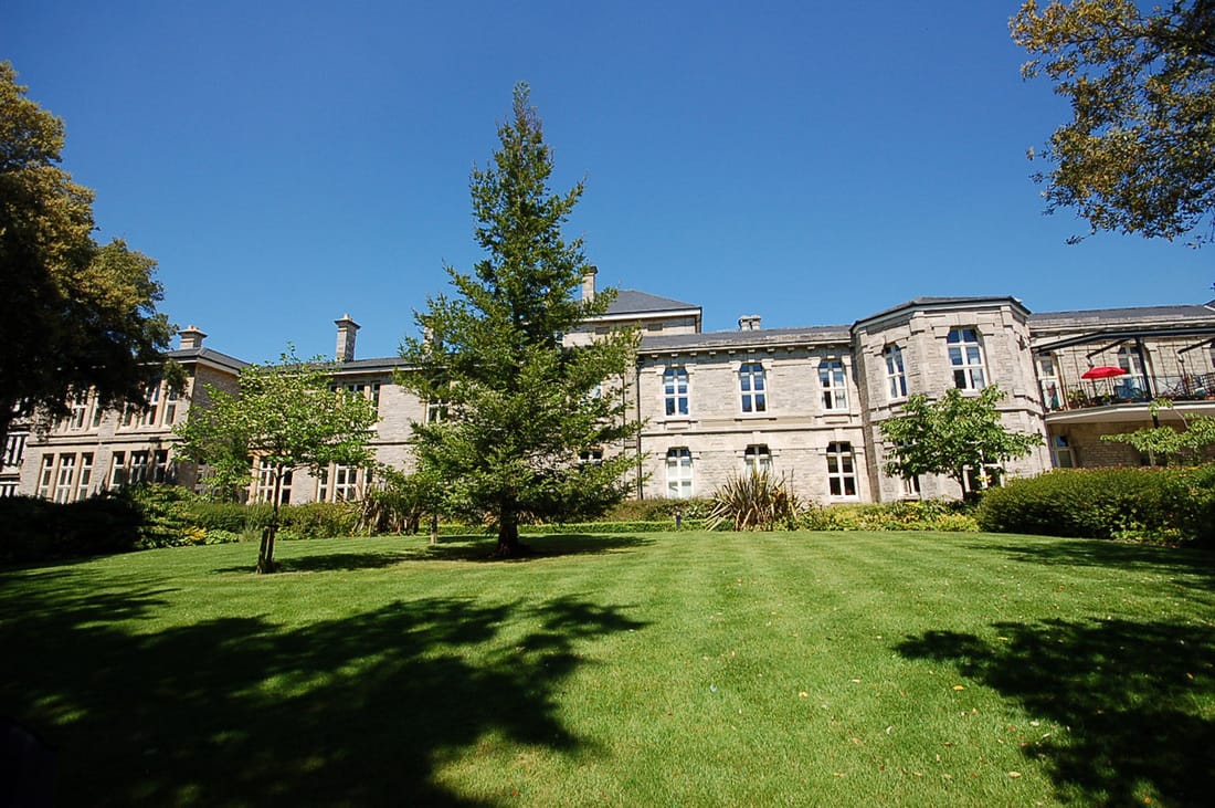 Exterior view of Brompton Court with green landscaping