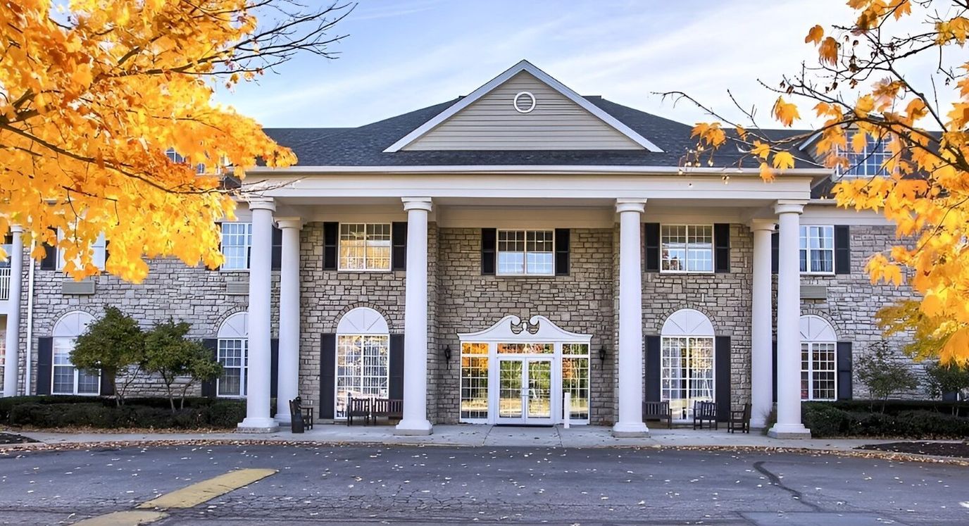 Exterior view of a senior living facility in autumn