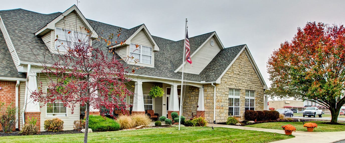 Exterior view of Brookdale Piqua with landscaping
