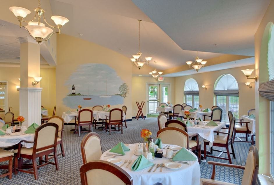 Bright dining room with tables set for meals