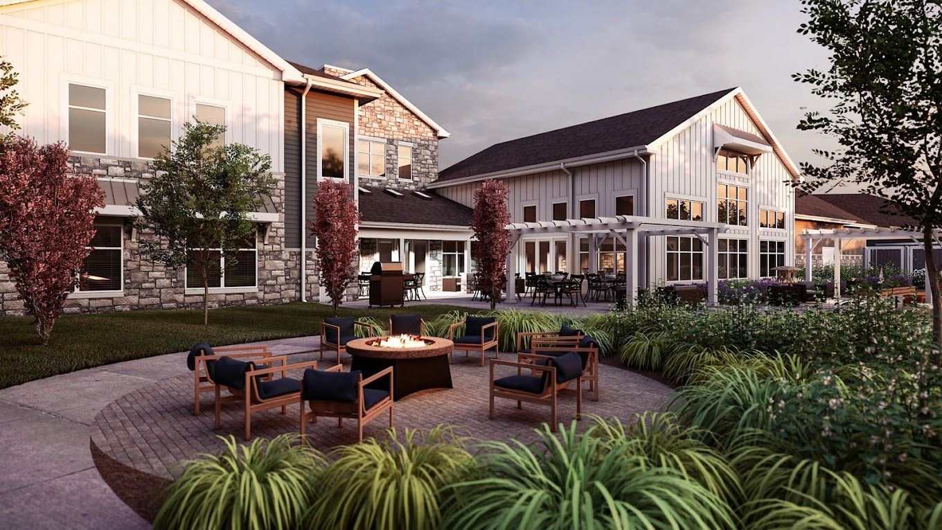 Outdoor seating area with fire pit and landscaped garden