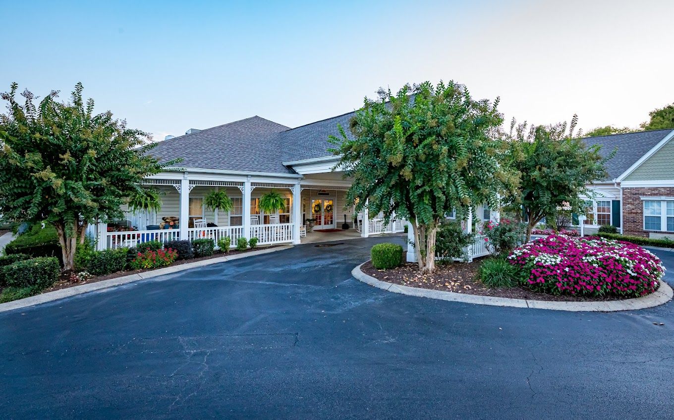 Front entrance of Charter Senior Living facility with landscaping