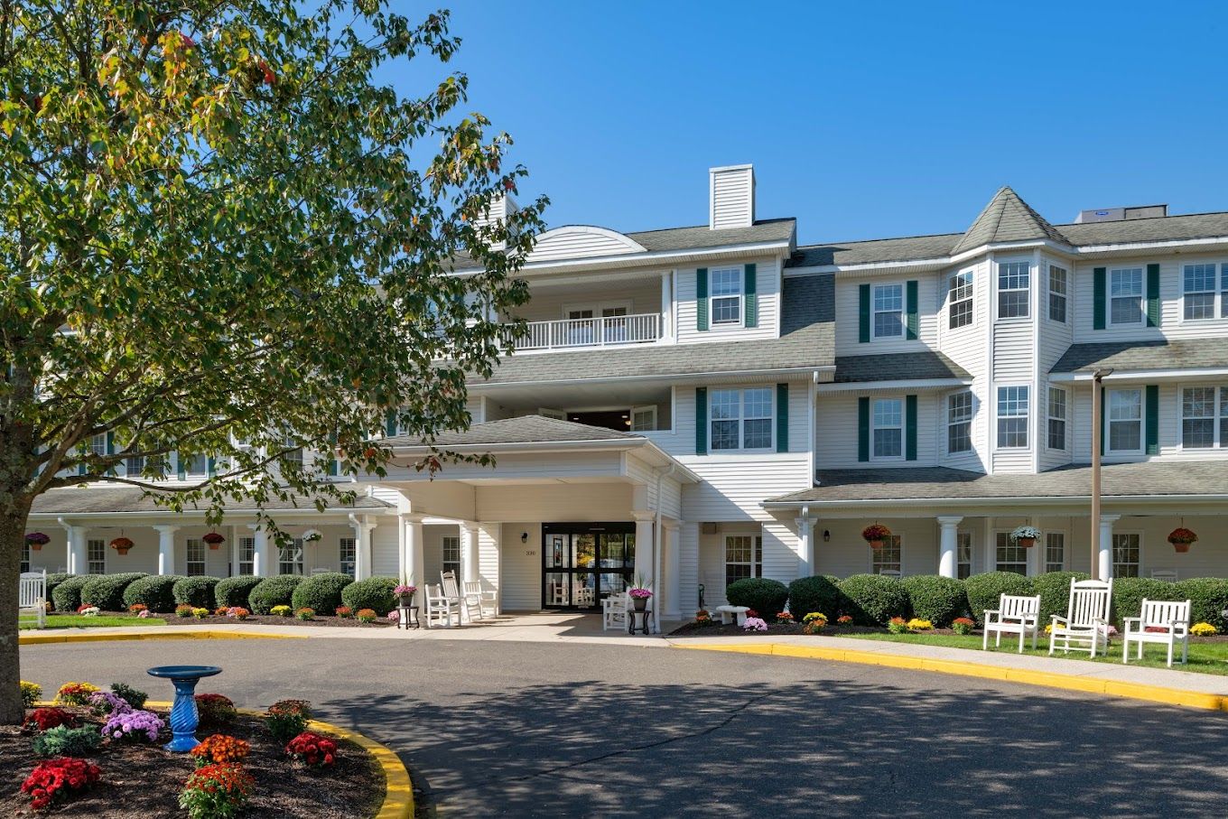 Front entrance of Charter Senior Living with landscaping