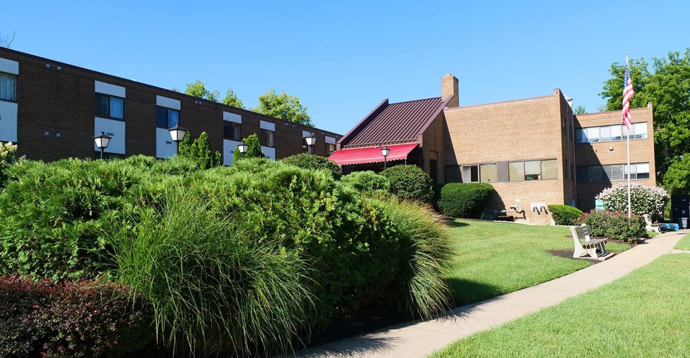 Exterior view of Clovernook Health Care LLC with landscaped grounds
