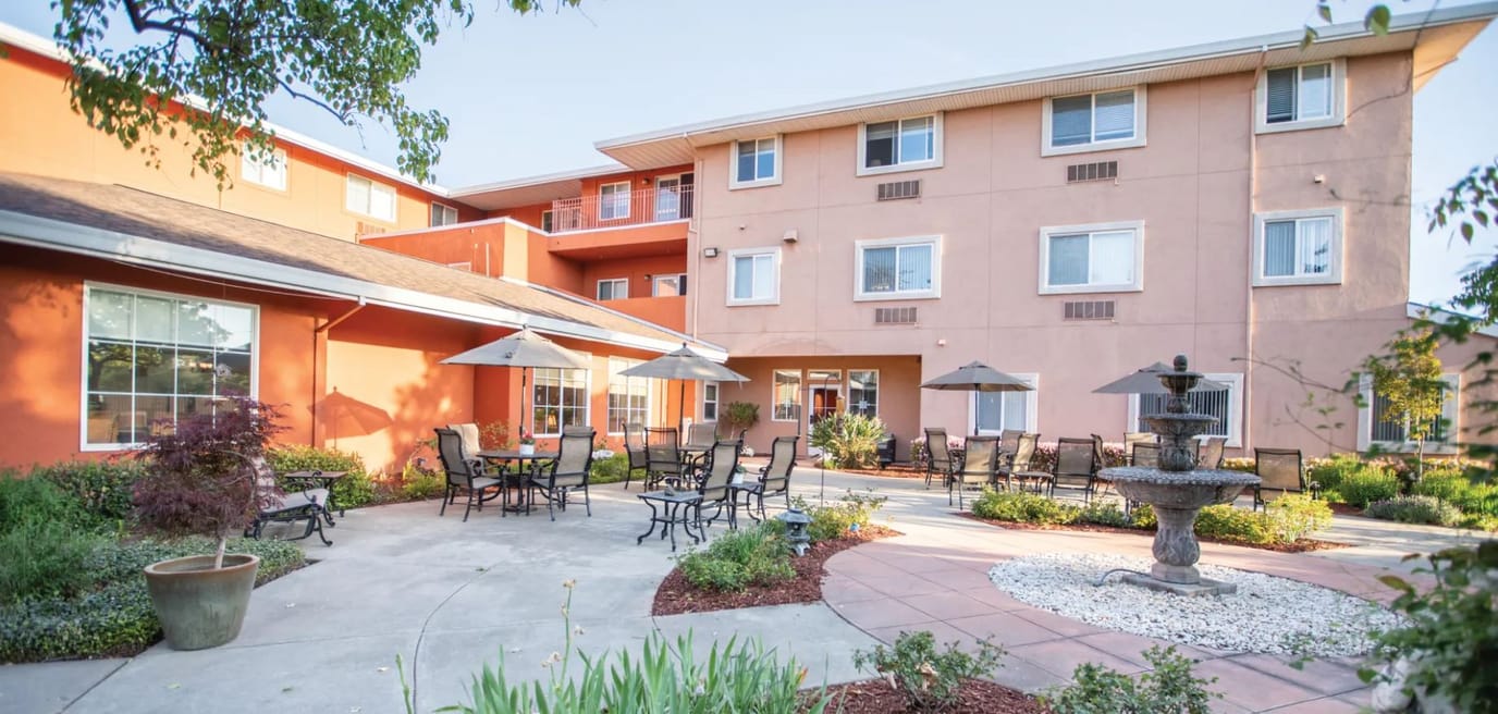 Outdoor courtyard with tables and fountain