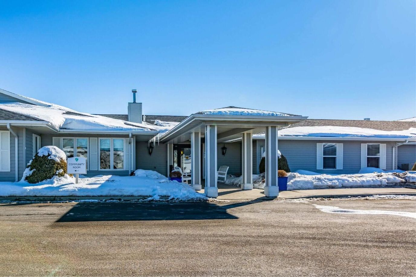 Facade of Elison Assisted Living of Minot with snowy surroundings