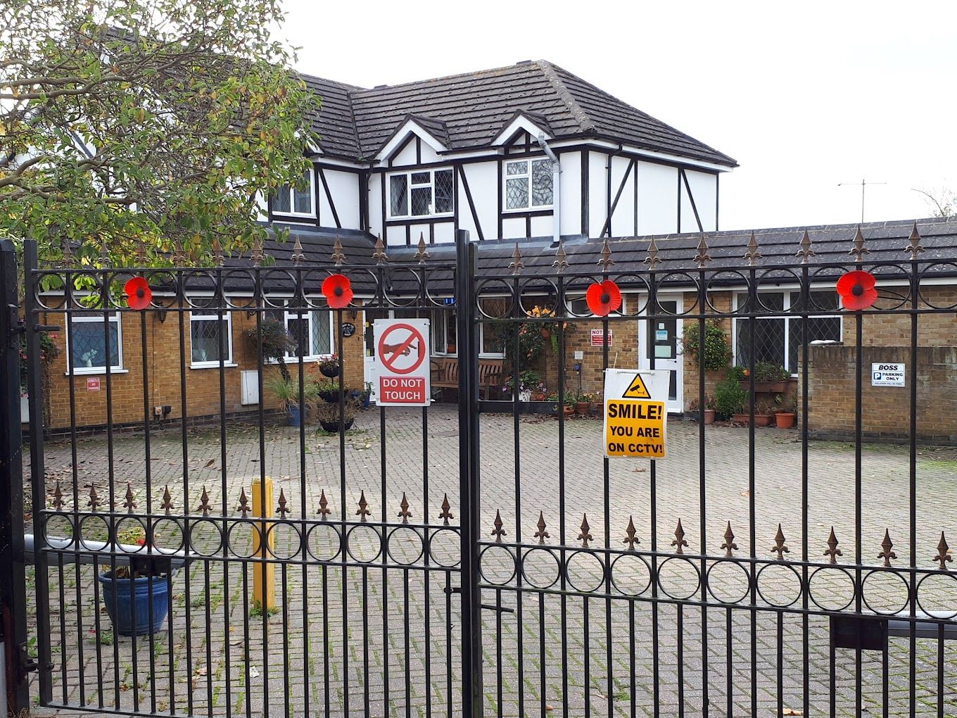 Exterior view of a residential home with gated entrance