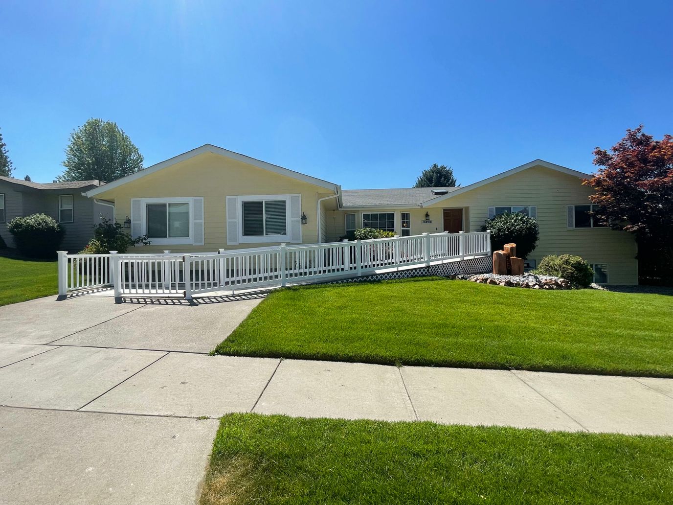 Exterior view of Ahadi Adult Family Home with accessible walkway