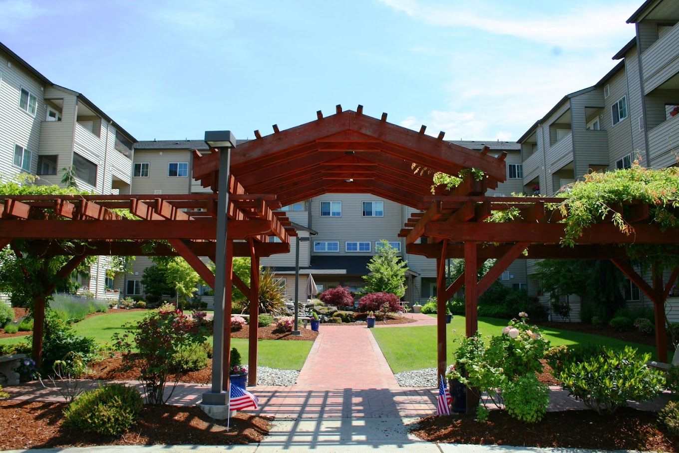 Entrance to Gibson Gardens with landscaping and a walkway