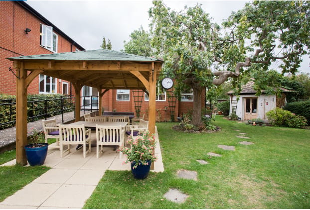 Outdoor gazebo in a landscaped garden area