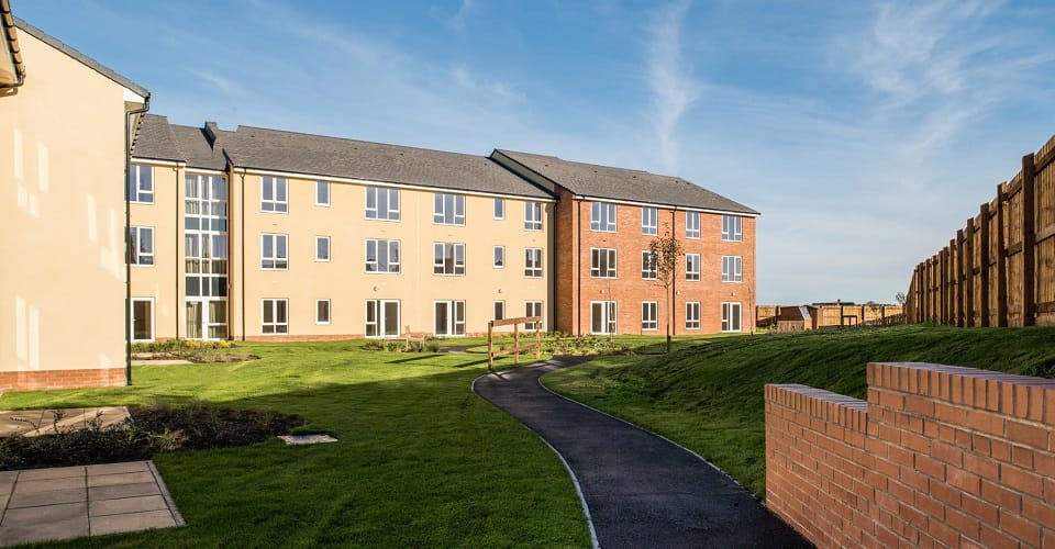 Building exterior with landscaped pathway