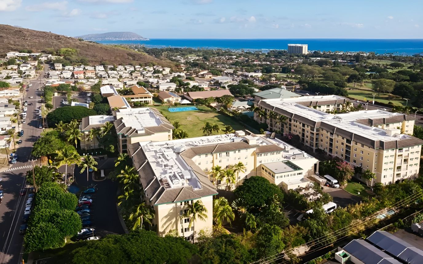 Aerial view of a senior living campus near the coast