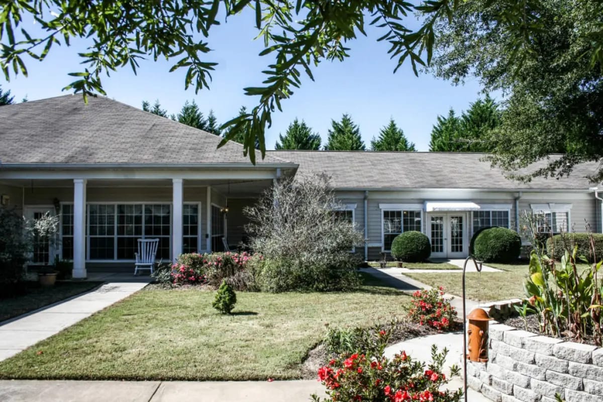 Exterior view of the assisted living facility with garden