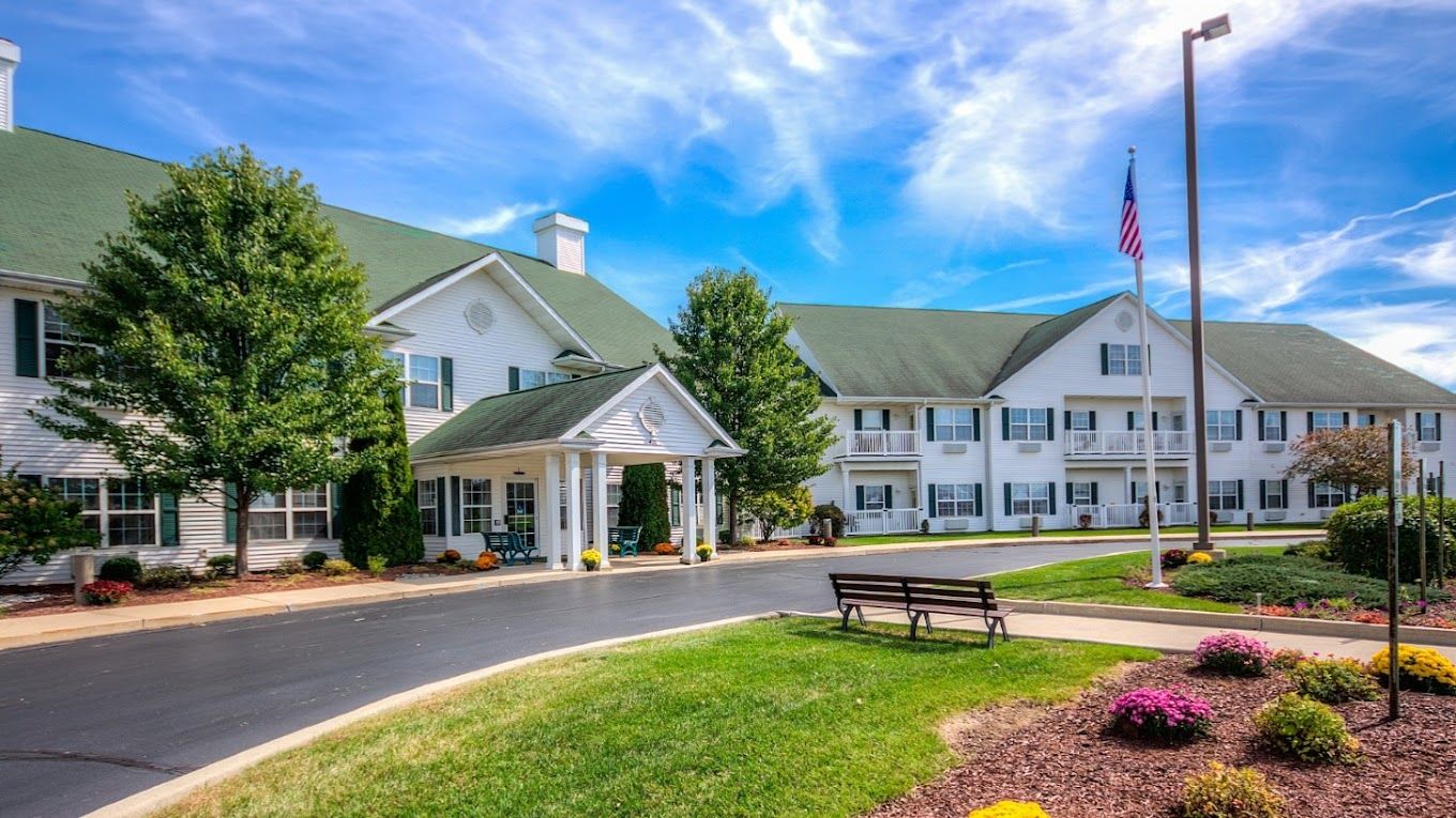 Exterior view of McKay Manor with gardens and pathway