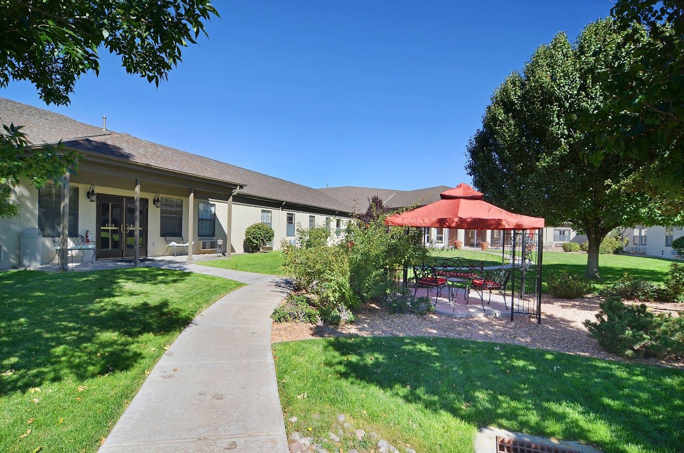 Outdoor seating area with gazebo and pathway