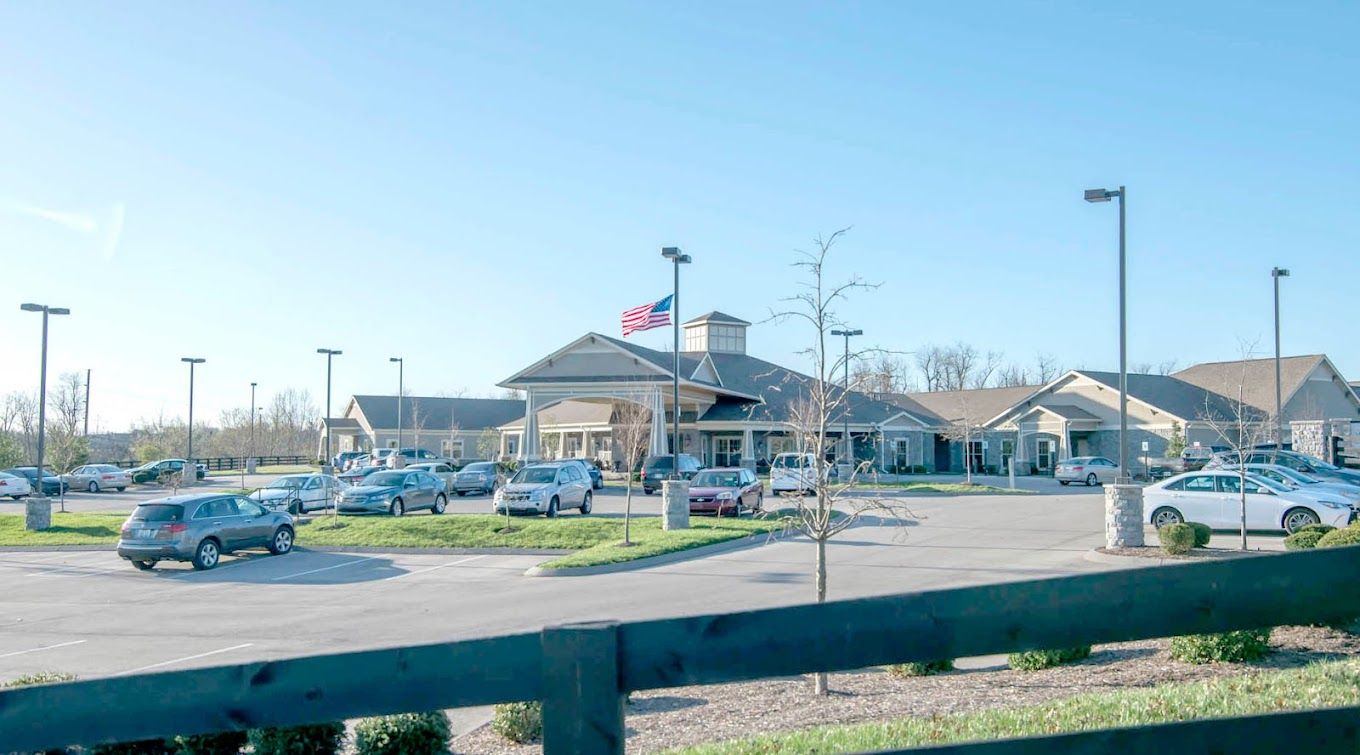 Exterior view of Morning Pointe of Lexington East with parking