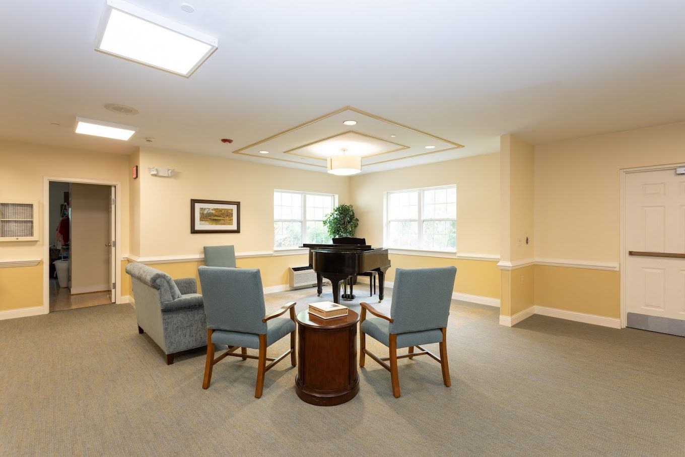 Bright and inviting common area with a piano