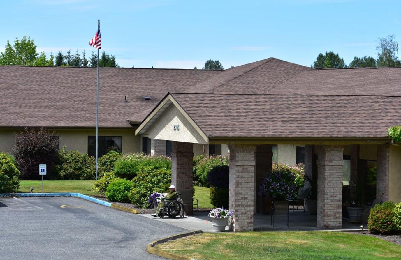 Exterior view of Mt. Baker Care Center with manicured gardens