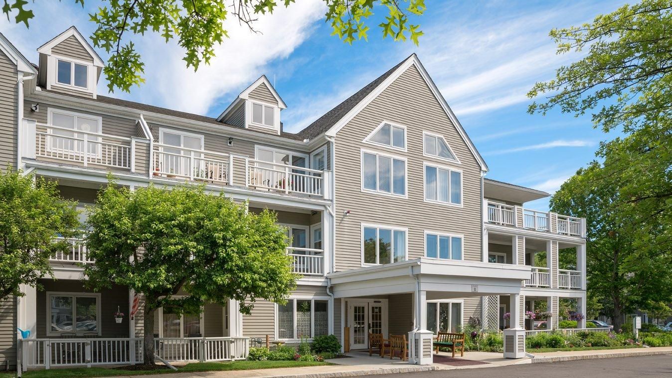 Exterior view of New Pond Village with greenery