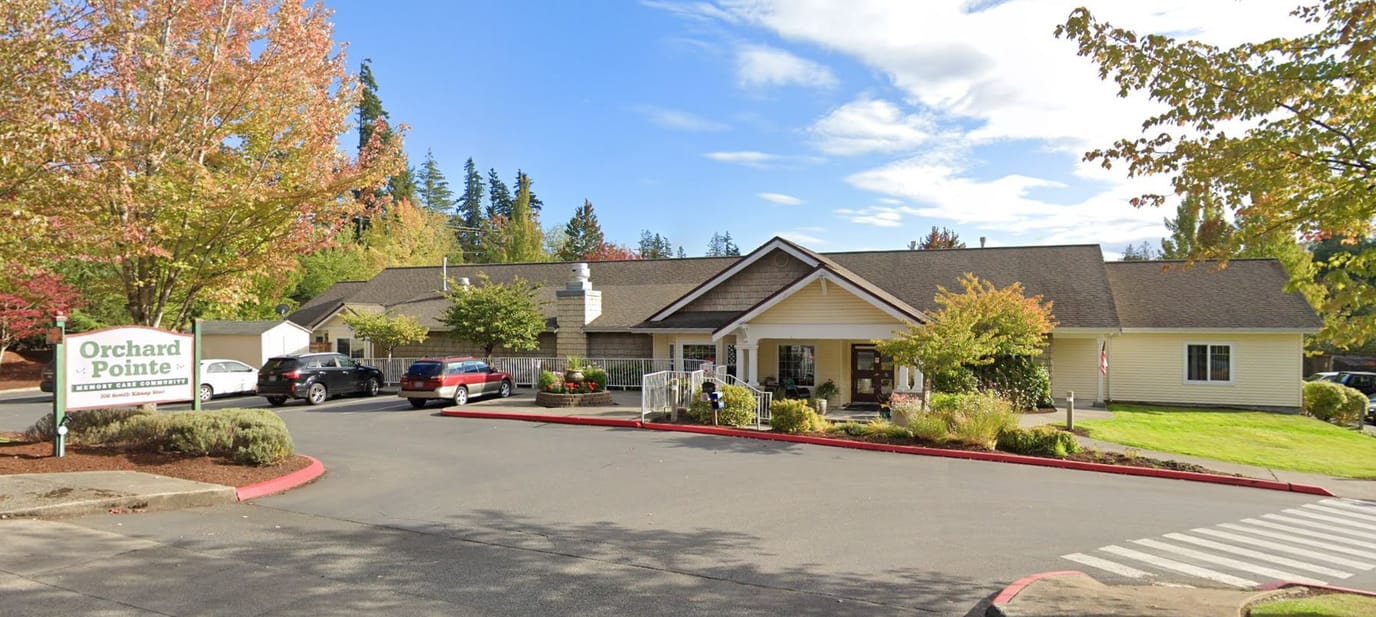 Exterior view of Orchard Pointe facility with landscaping